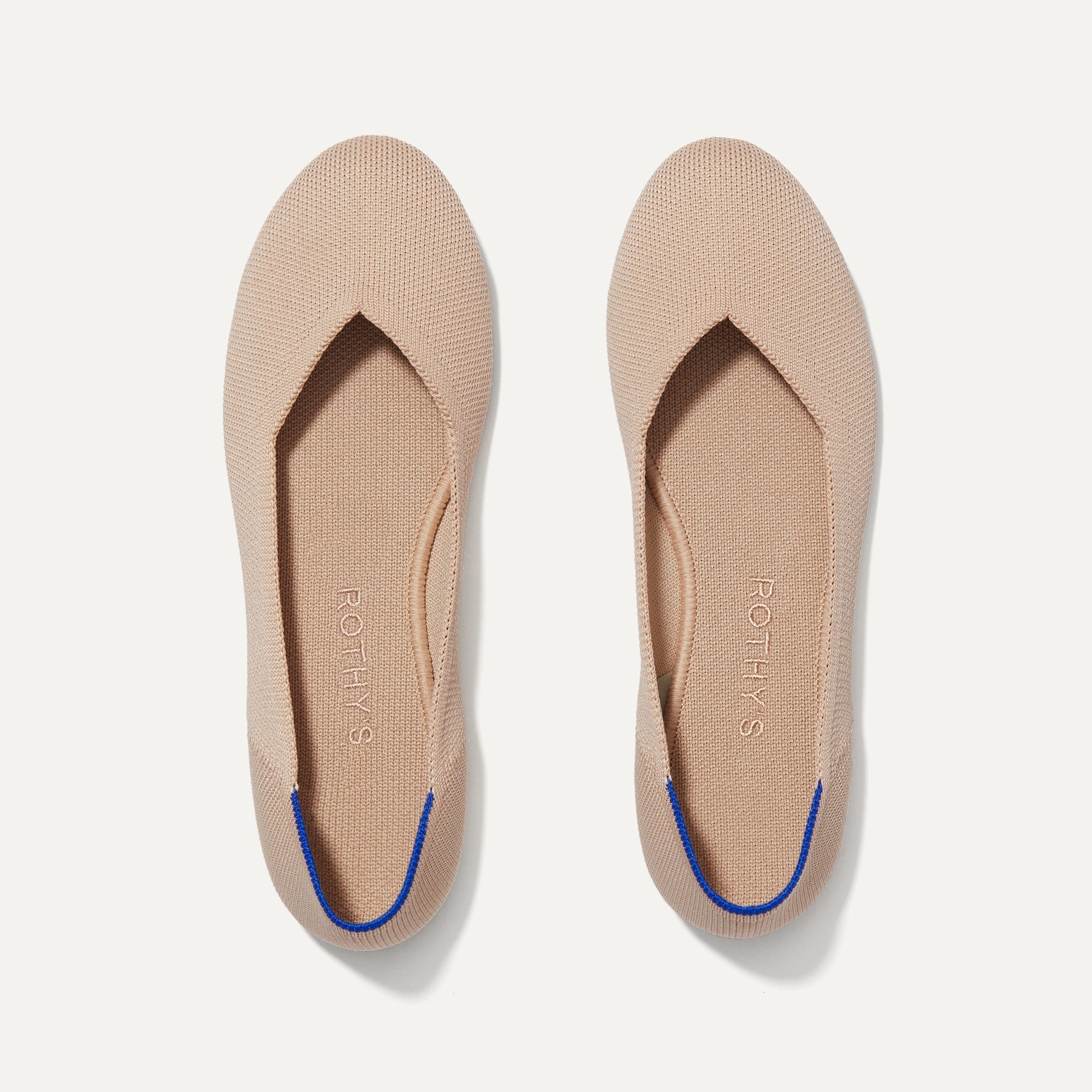 A pair of The Flat round toe shoes in Ecru shown from the top view.