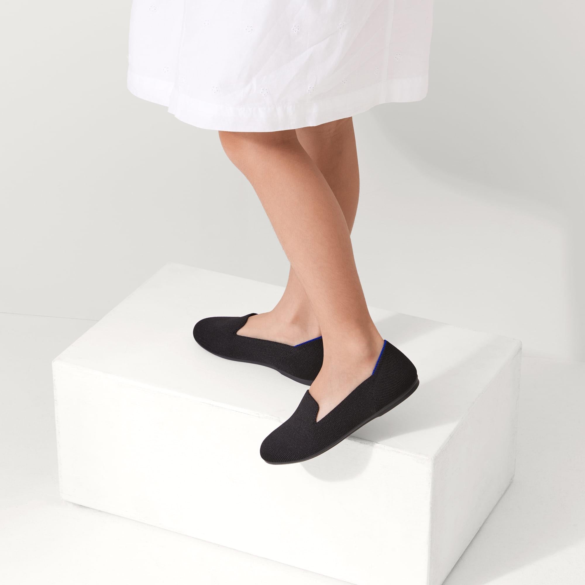 hover | The Kids slip-on Loafer in Black Solid shown on-model at an angle.