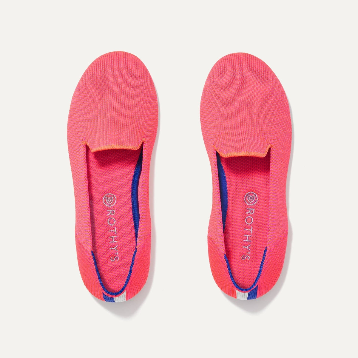 A pair of The Kids slip-on Loafers in Flamingo shown from the top view.