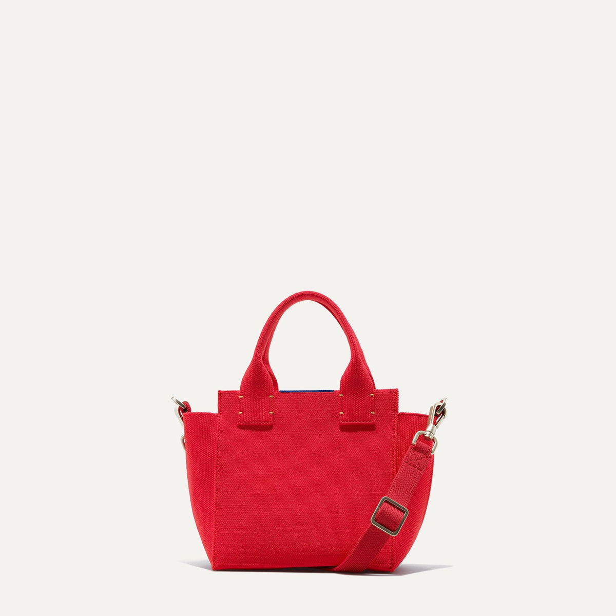 PLP |The Mini Handbag in Candy Apple shown from the front.