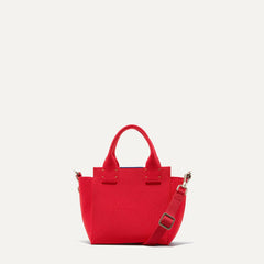 PLP |The Mini Handbag in Candy Apple shown from the front.