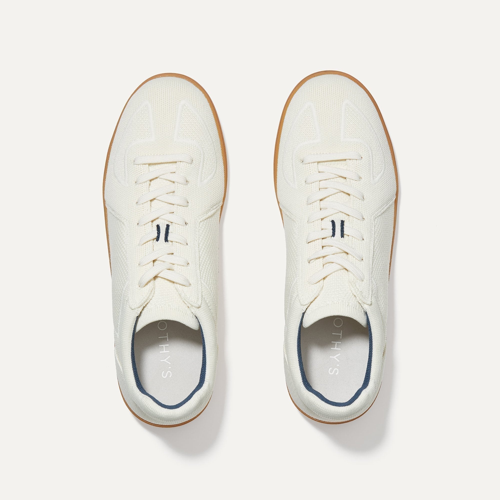 A pair of The RS01 Sneaker in Bone shown from the top.