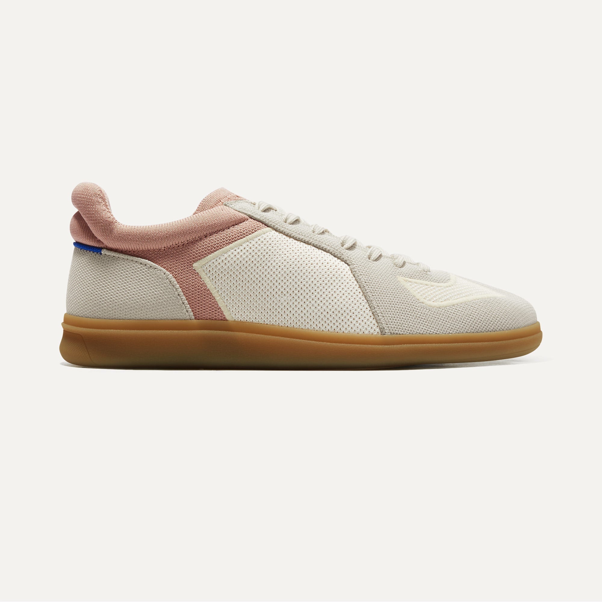 The RS01 Sneaker in Flamingo shown from the side.
