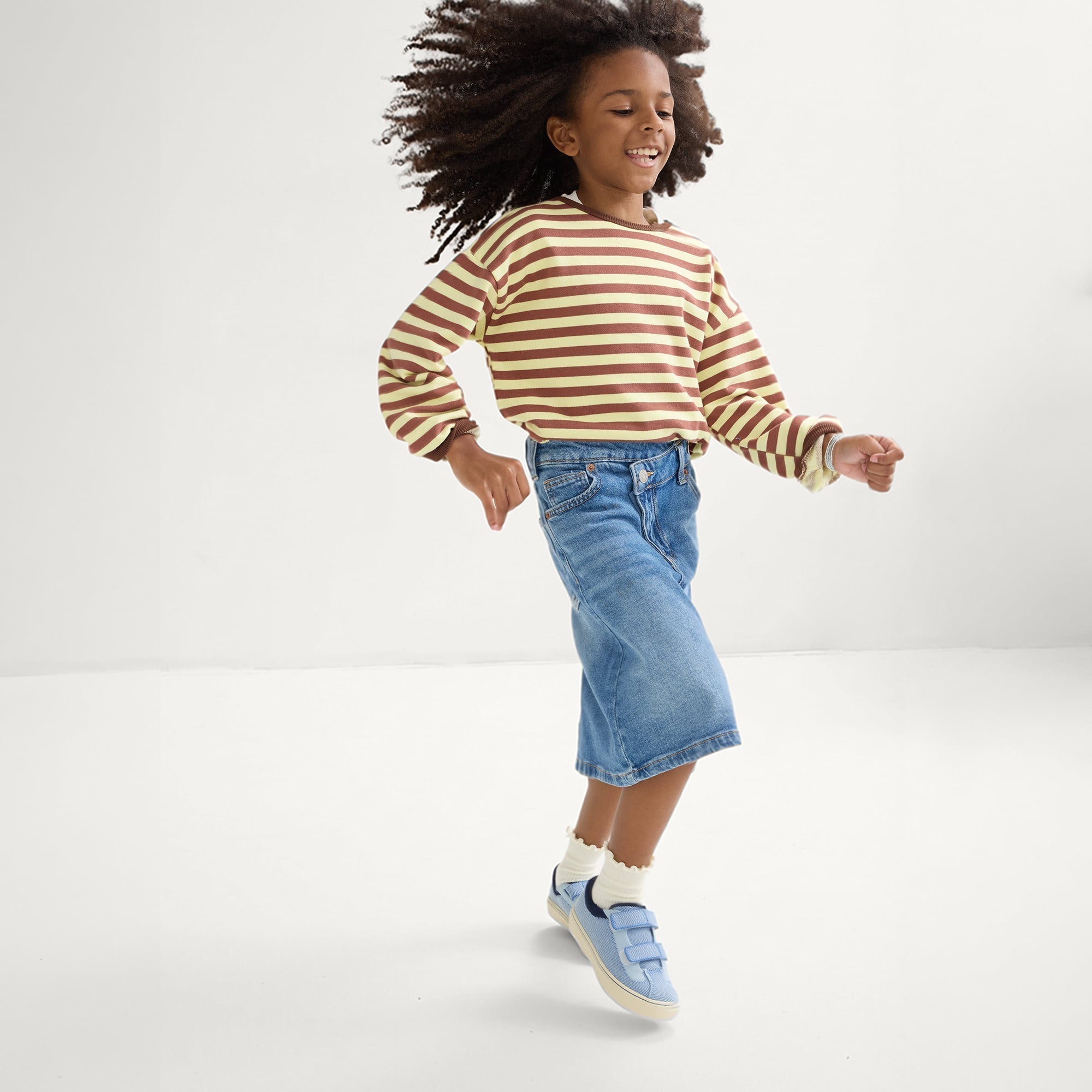 model | Alternate image of a boy modeling The Kids Strap Sneaker in Berry Blue. 