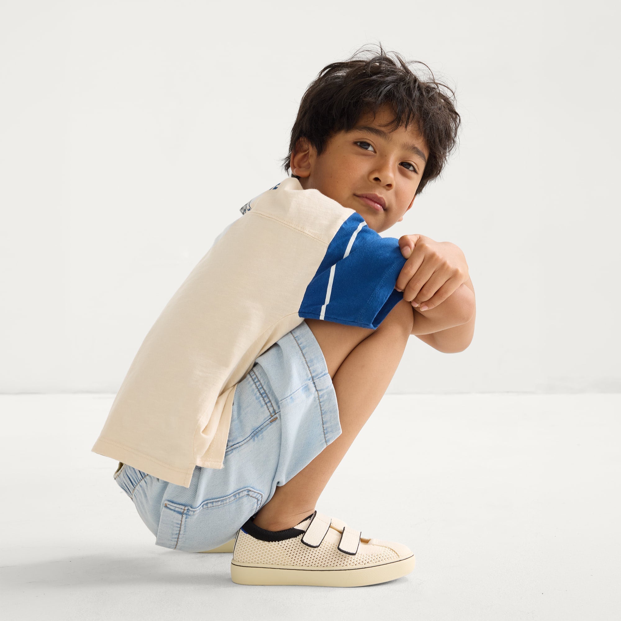 model | Alternate image of a boy modeling The Kids Strap Sneaker in Chess Open-Knit. 