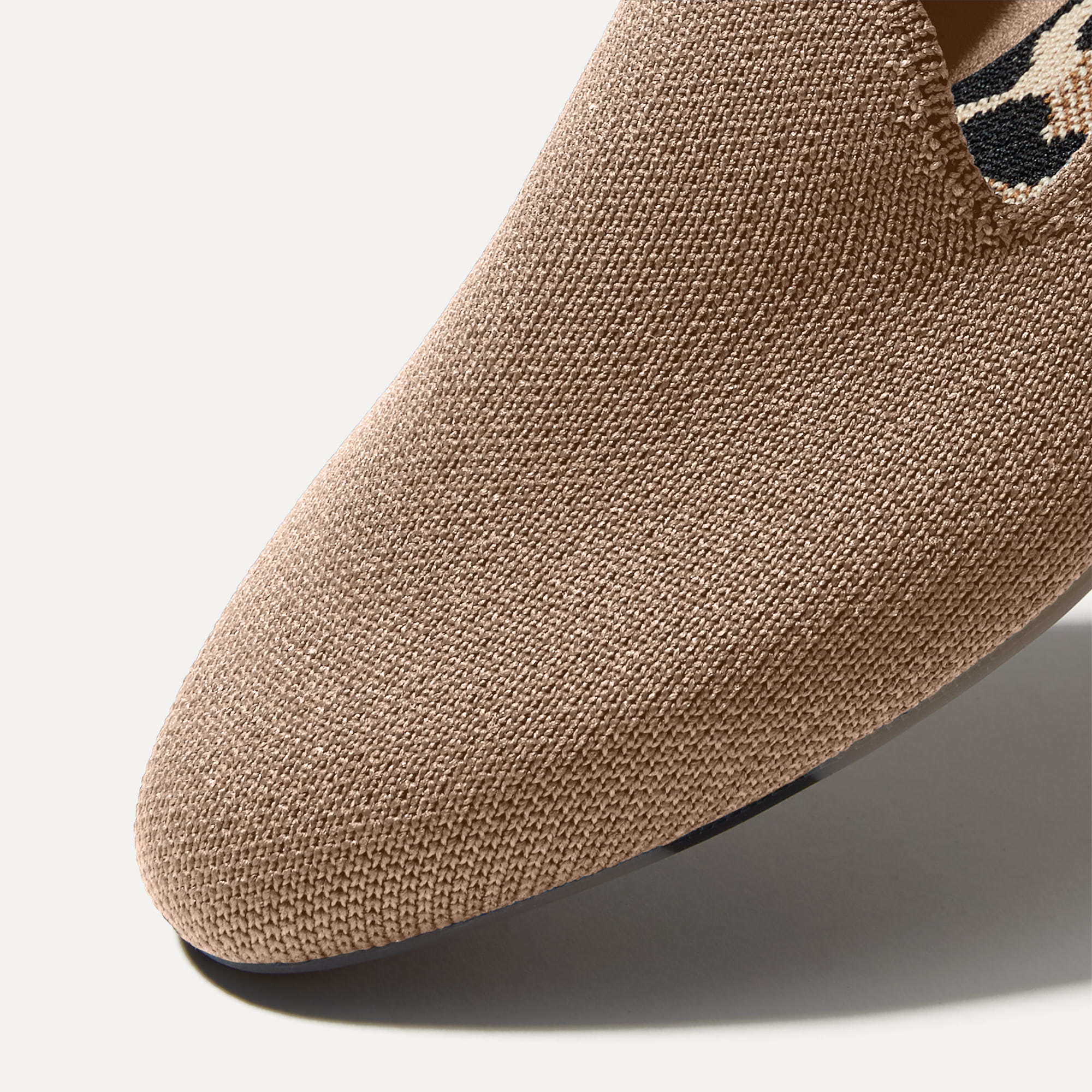 Close up of the toe and vamp of The Almond Loafer in Gold Dust. 