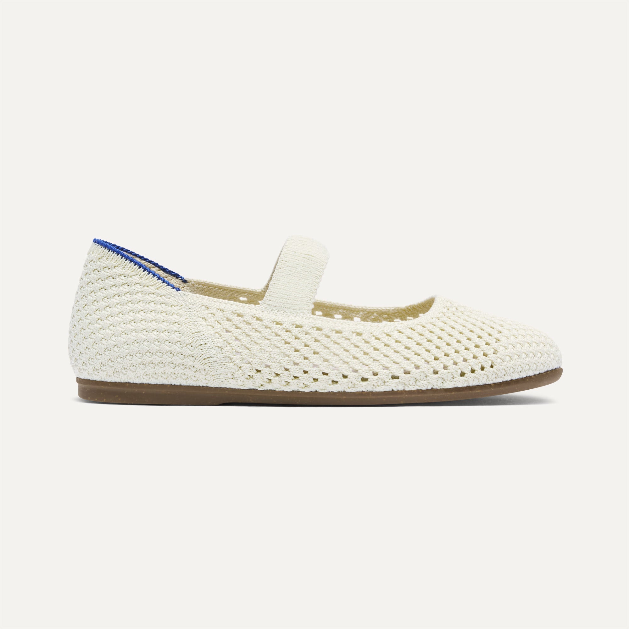 side | The Kids Mary Jane in White Open-Knit shown from the side.