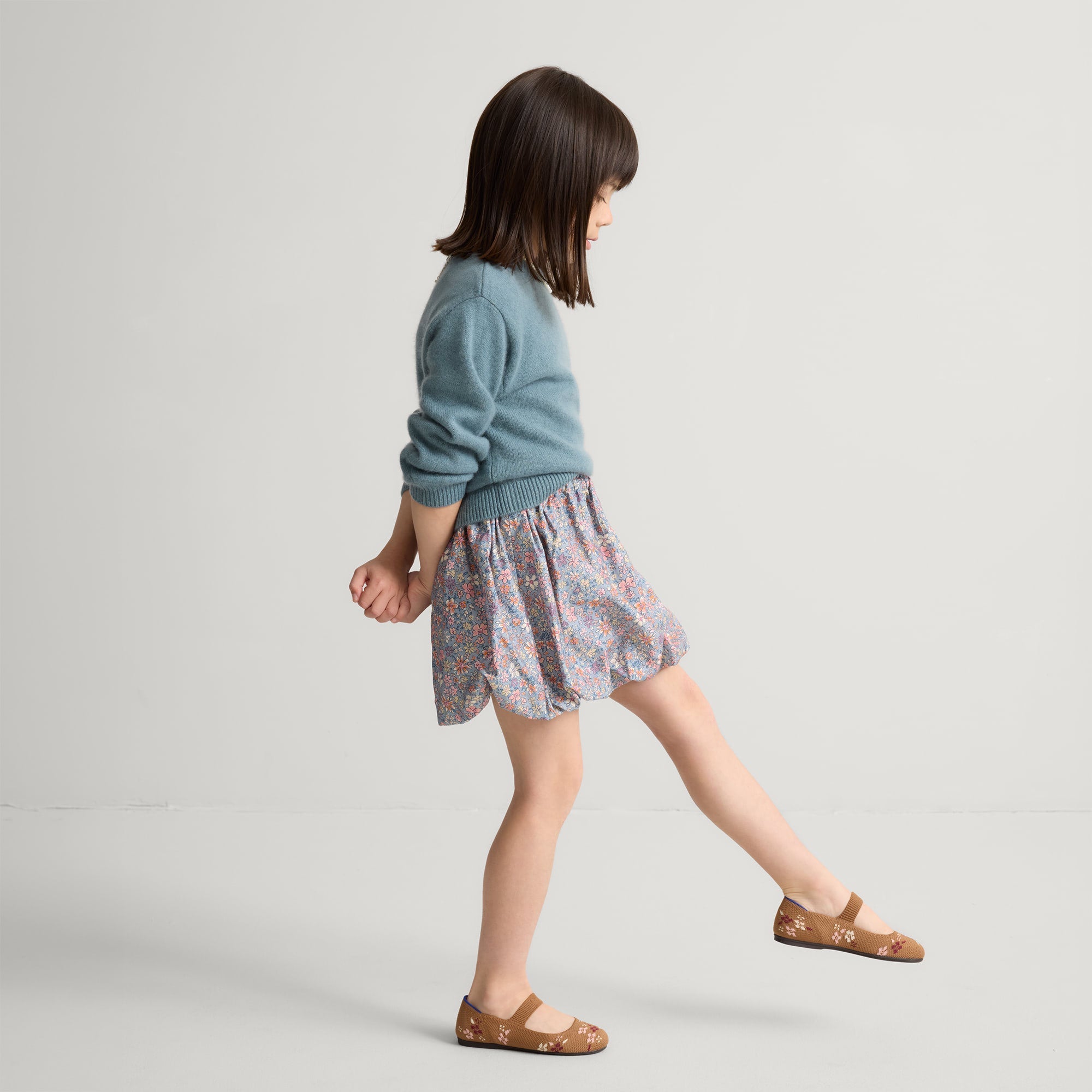 model | Alternate view of model wearing The Kids Mary Jane in Tawny Twig.