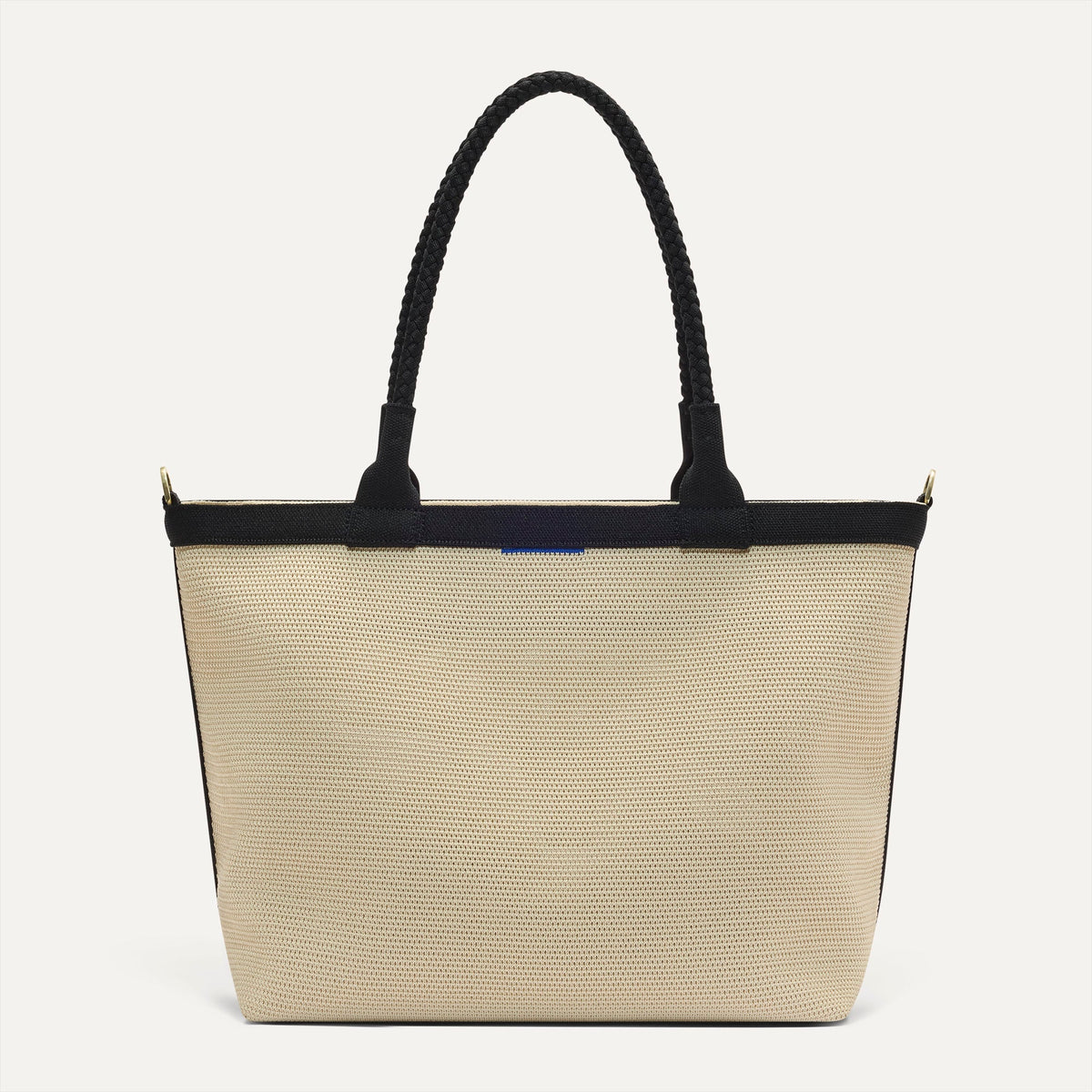 PDP |The Lightweight Zip Tote in Black and White Raffia-Knit shown from the front.