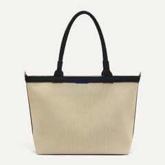PDP |The Lightweight Zip Tote in Black and White Raffia-Knit shown from the front.