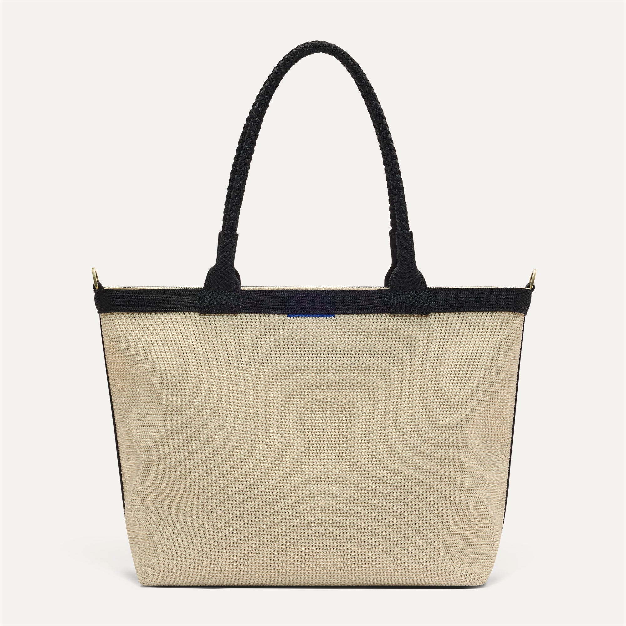 PDP |The Lightweight Zip Tote in Black and White Raffia-Knit shown from the front.