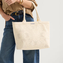 hover |Model holding The Lightweight Zip Tote in Moonflower.