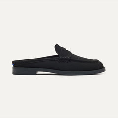 side | The Penny Loafer Mule in Black shown from the side.