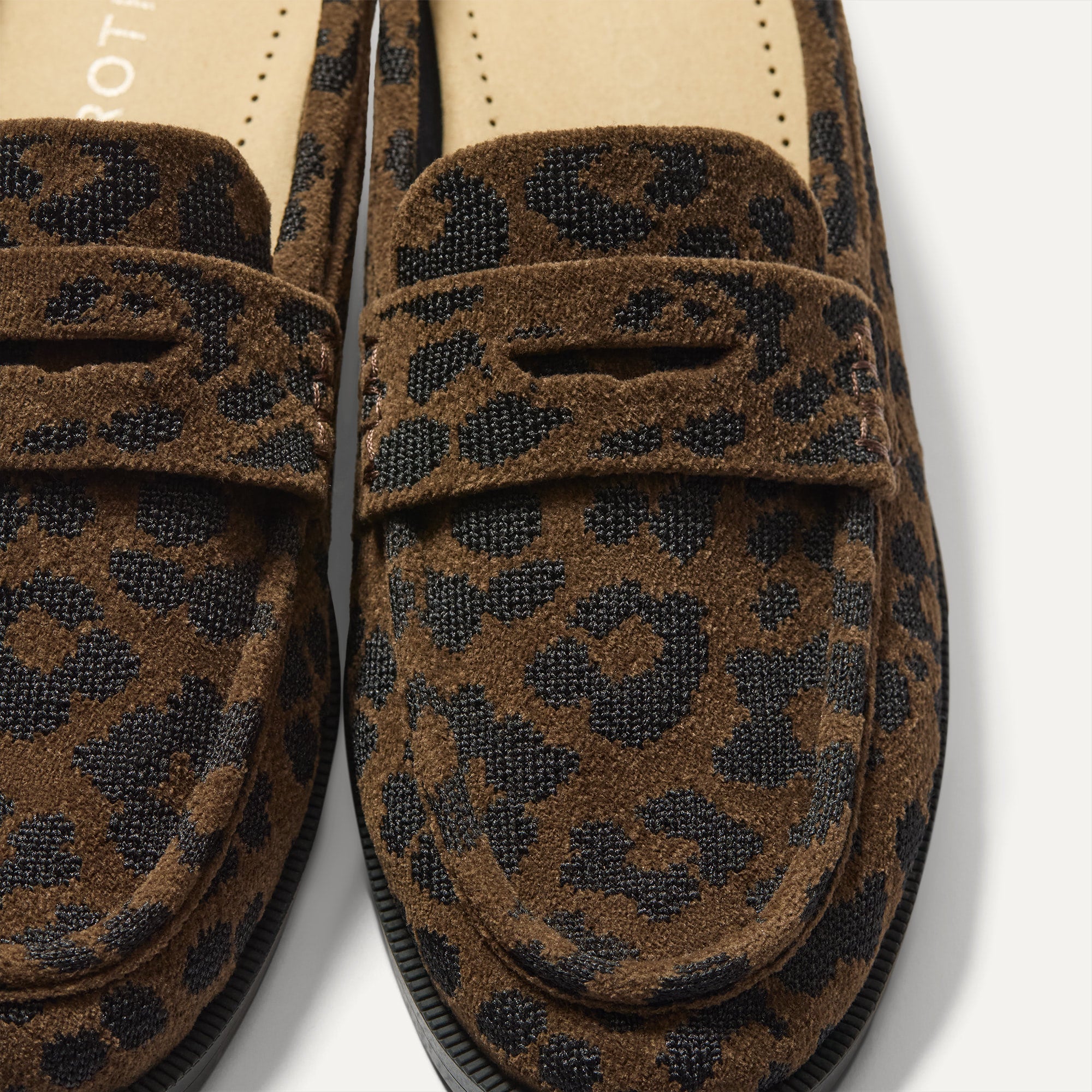 Close up of the toe and vamp of The Penny Loafer Mule in ReVelvet Cheetah, showing the penny keeper detail.
