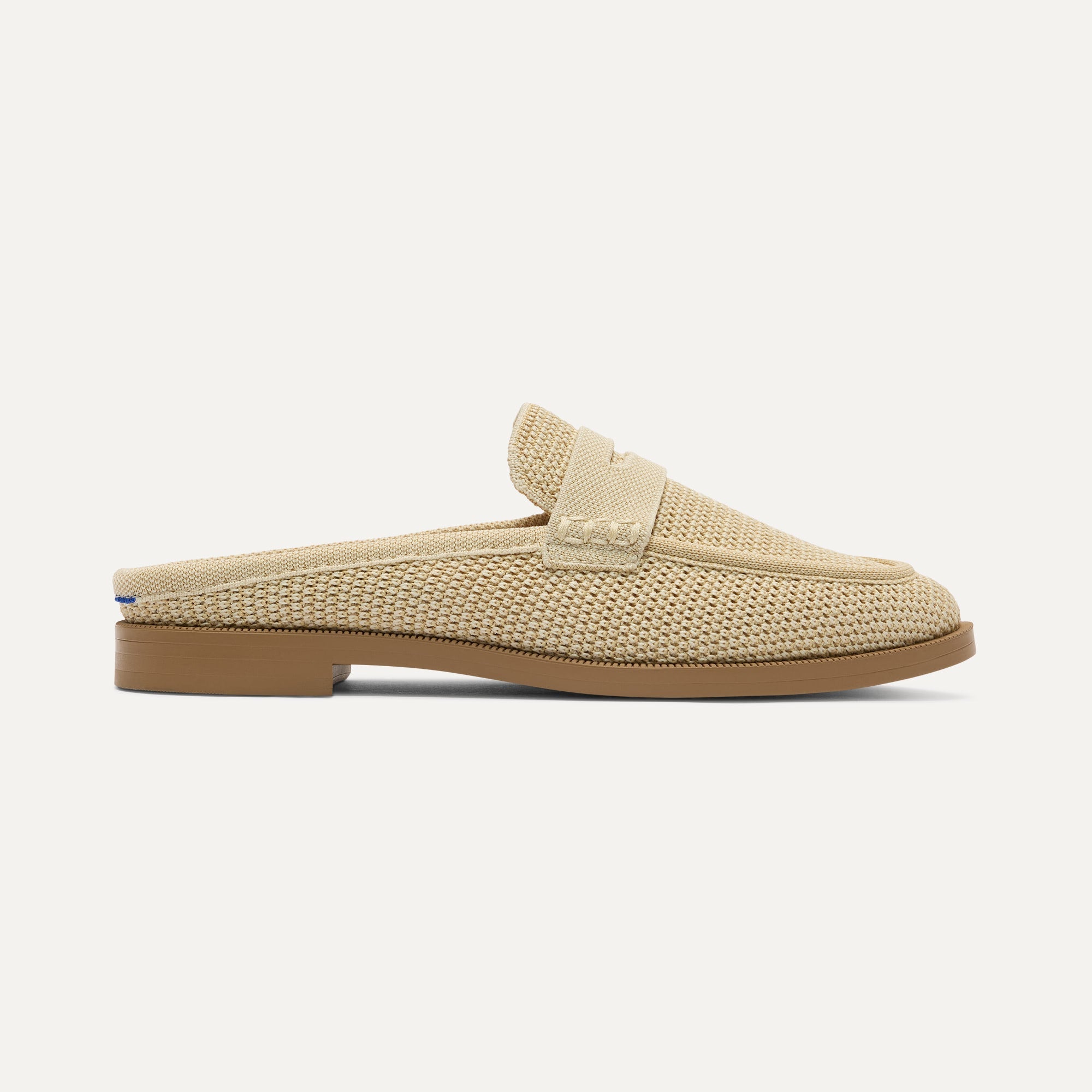 side | The Penny Loafer Mule in Sandstone Raffia-Knit shown from the side.