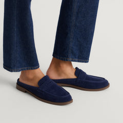 hover | Model wearing The Penny Loafer Mule in ReVelvet Navy.