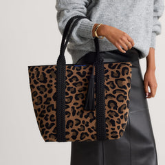 hover | Model holding The Revelvet Lightweight Tote in Revlvet Cat.