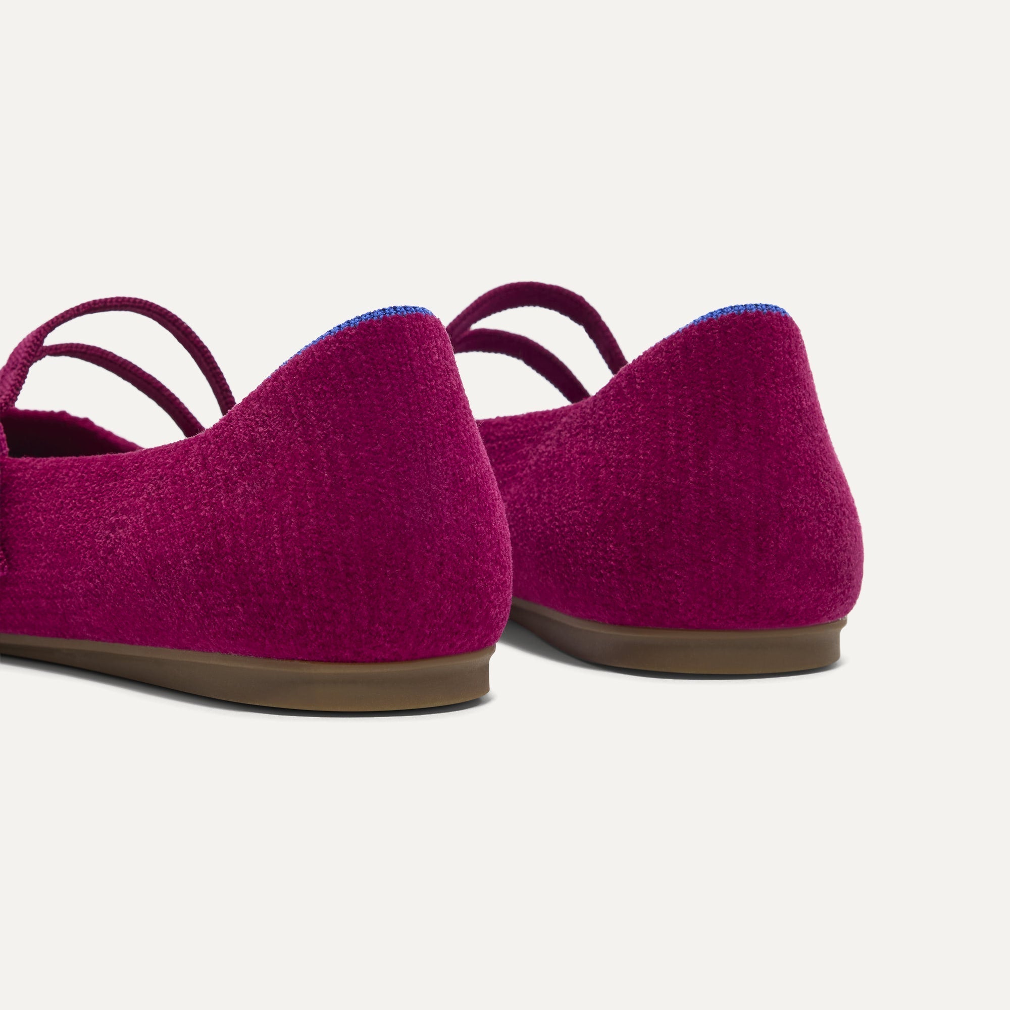 Close up of the heel of The Double Buckle Mary Jane in ReVelvet Mulberry, with Rothy's signature blue halo.