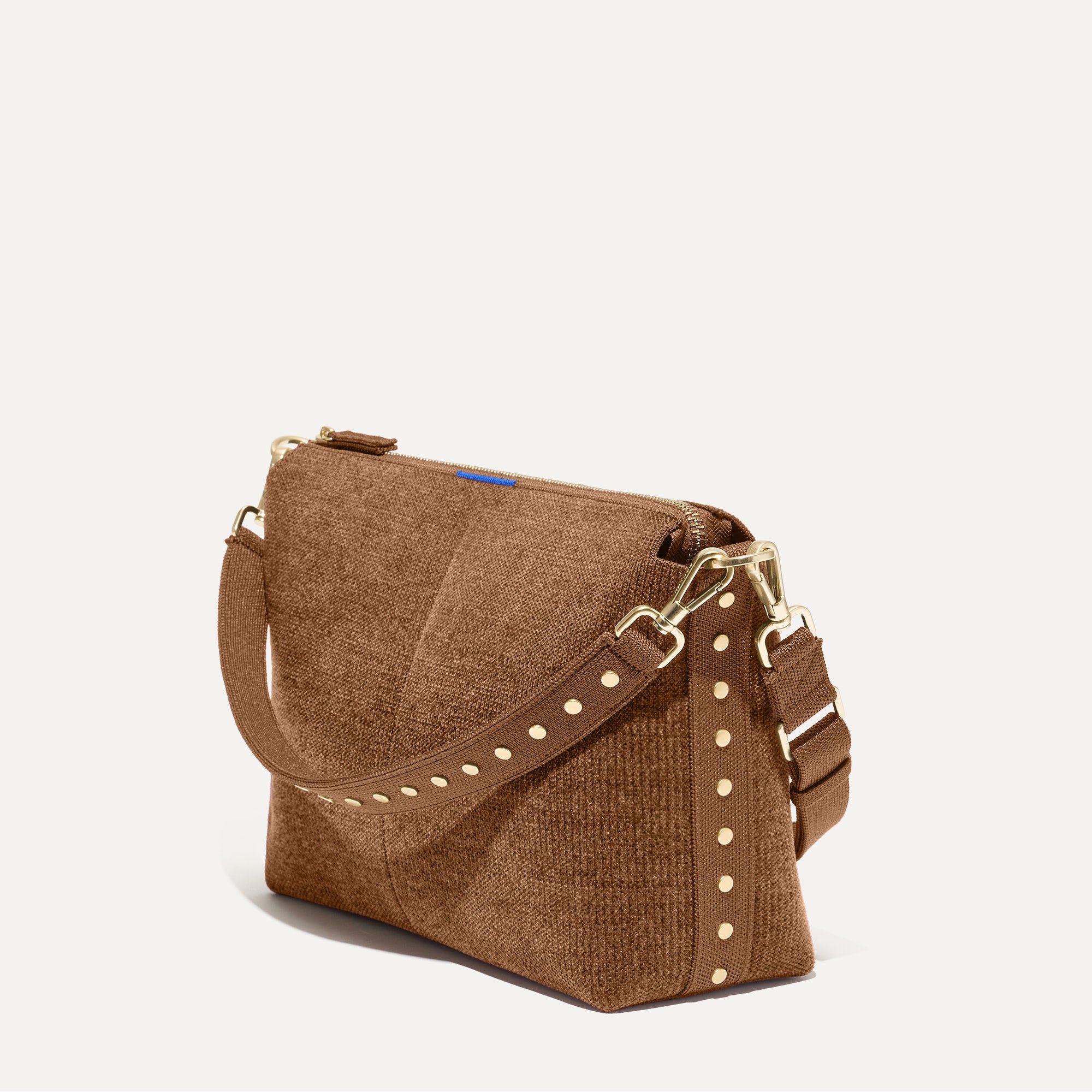 The Daily Crossbody in Revelvet™ Cinnamon shown at a diagonal view from the left.
