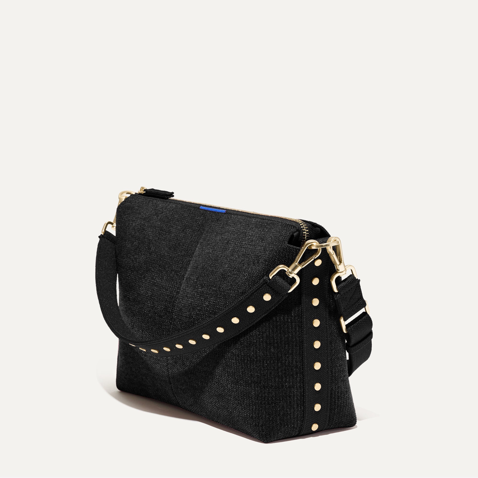 The Daily Crossbody in Revelvet™ Black shown at a diagonal view from the left.