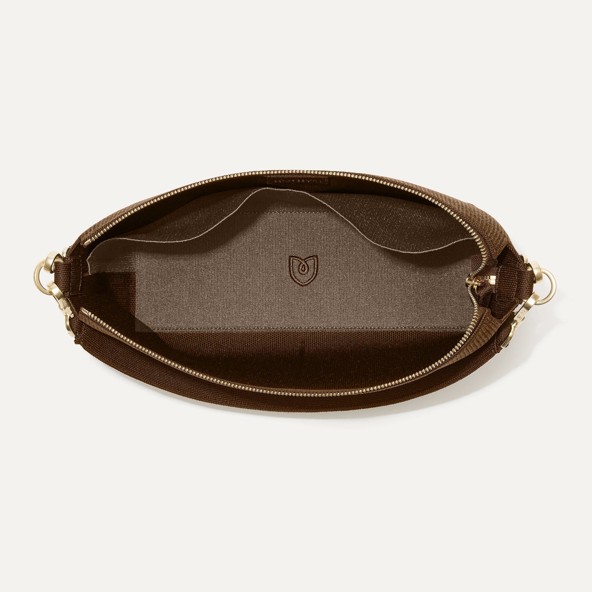 The Daily Crossbody in Revelvet™ Cinnamon shown from the top down, with zipper open and interior exposed.