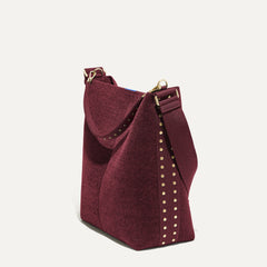 hover | The Bucket Bag in ReVelvet™ Syrah in a diagonal view.