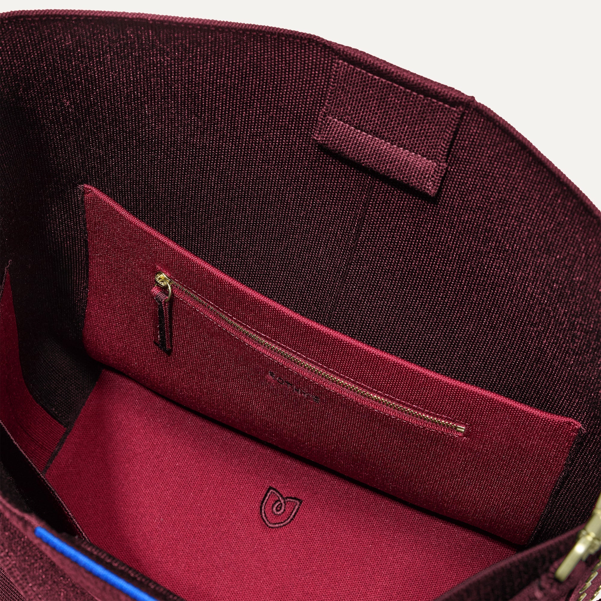 The Bucket Bag in ReVelvet™  close up of interior zipper pocket.