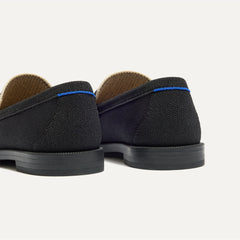 Close up of the heel of The Penny Loafer in Tuxe, with Rothy's signature blue halo. 