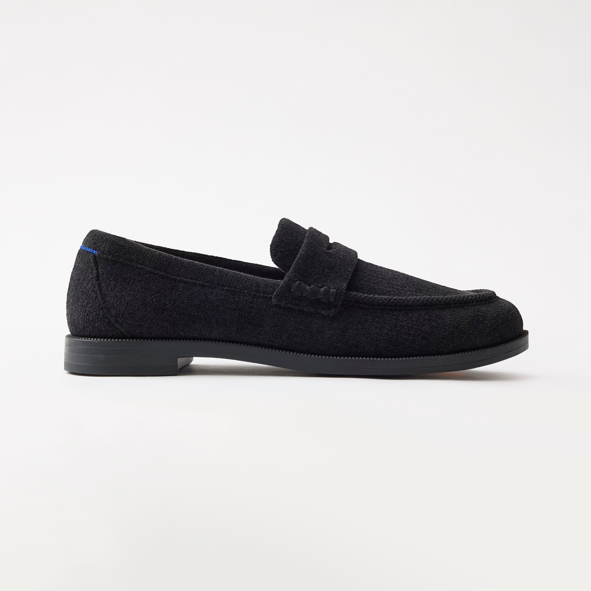 side | The Penny Loafer in ReVelvet Black shown from the side. 