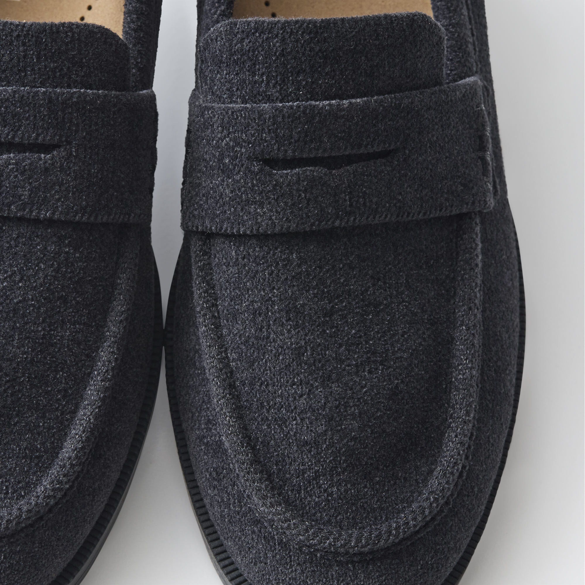 macro | Close up of the toe box and penny keeper of The Penny Loafer in ReVelvet Black.