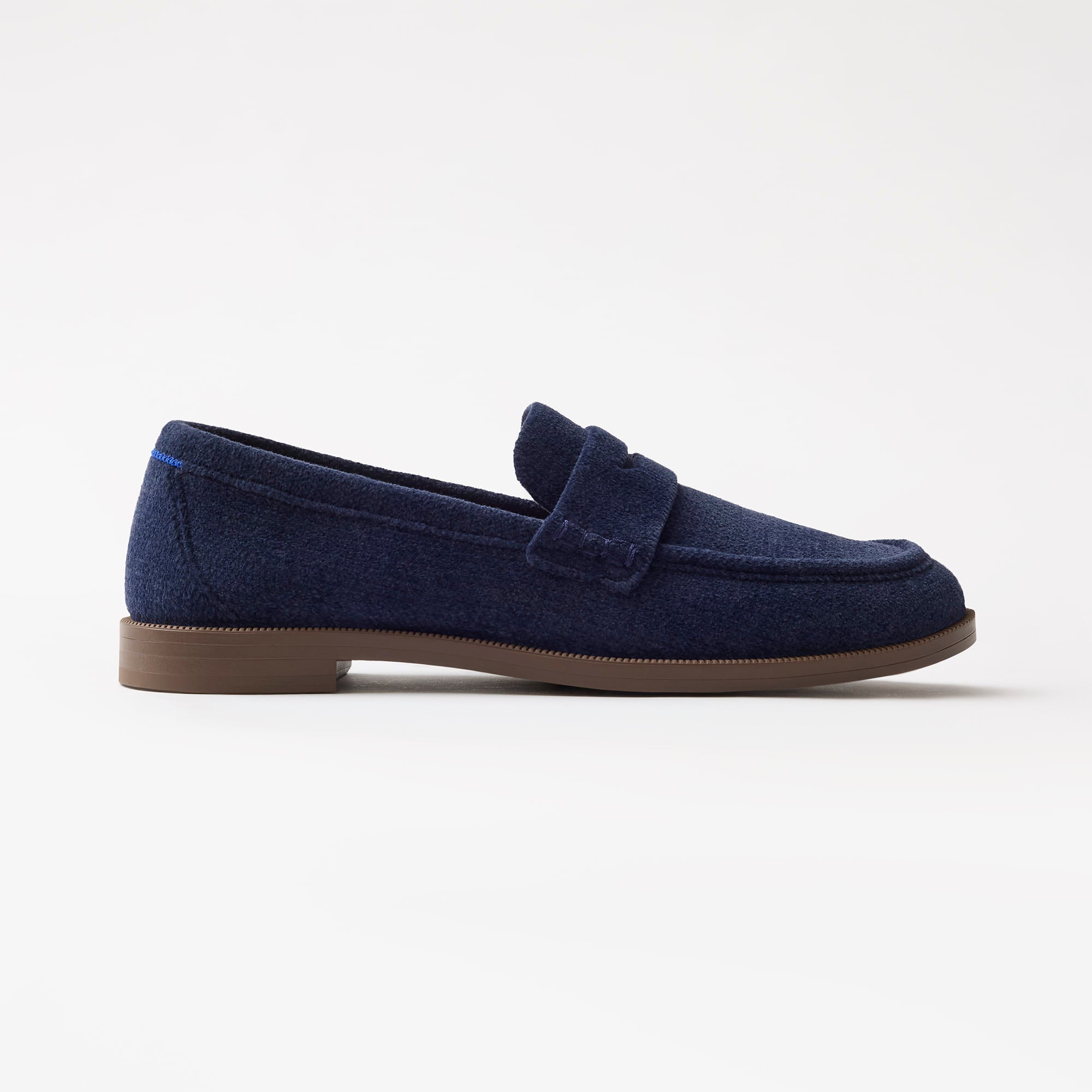side | The Penny Loafer in ReVelvet Navy shown from the side. 