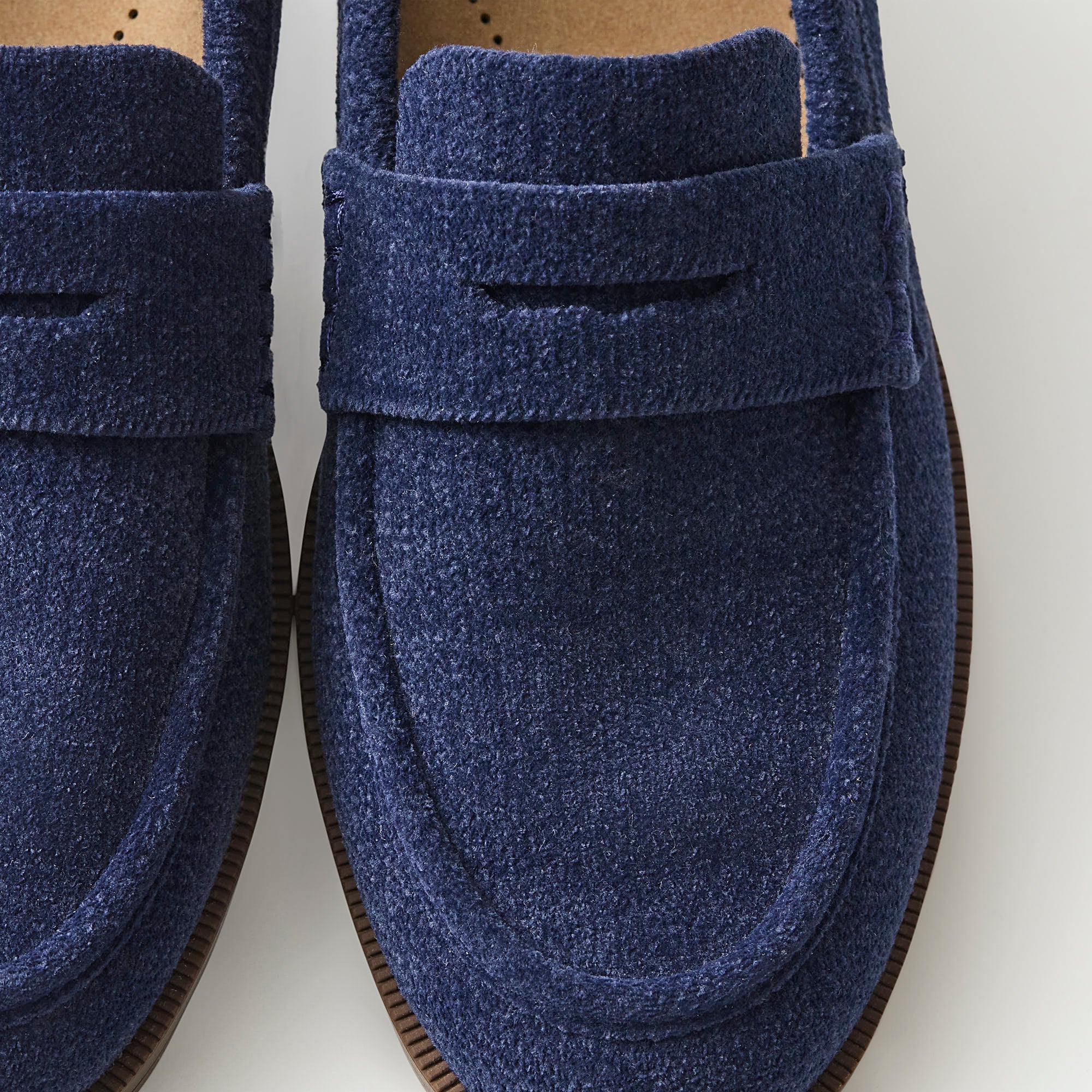 macro | Close up of the toe box and penny keeper of The Penny Loafer in ReVelvet Navy.