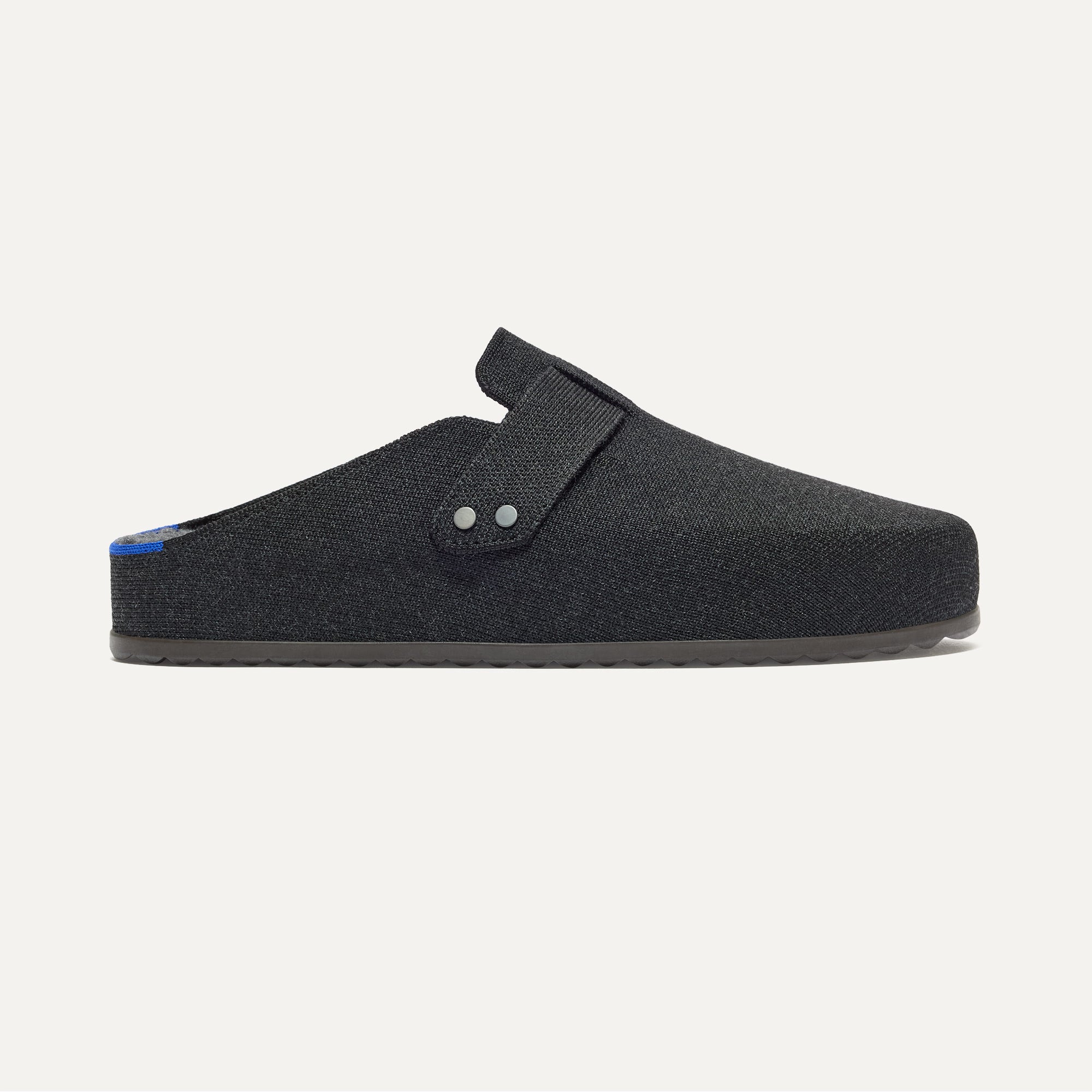 The Men's Cozy Clog in Black shown from the side. 