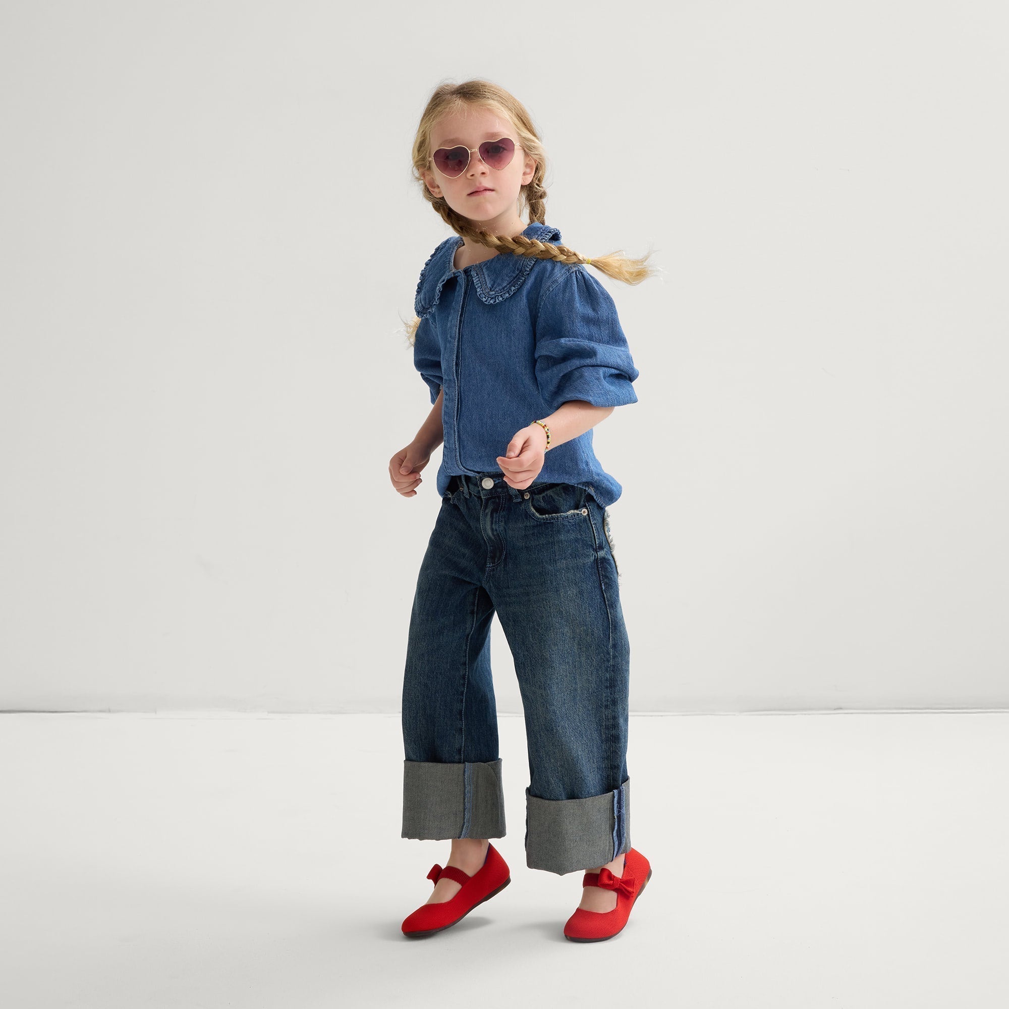 model | Alternate view of a model wearing The Kids Tux Bow Mary Jane in Bright Red.