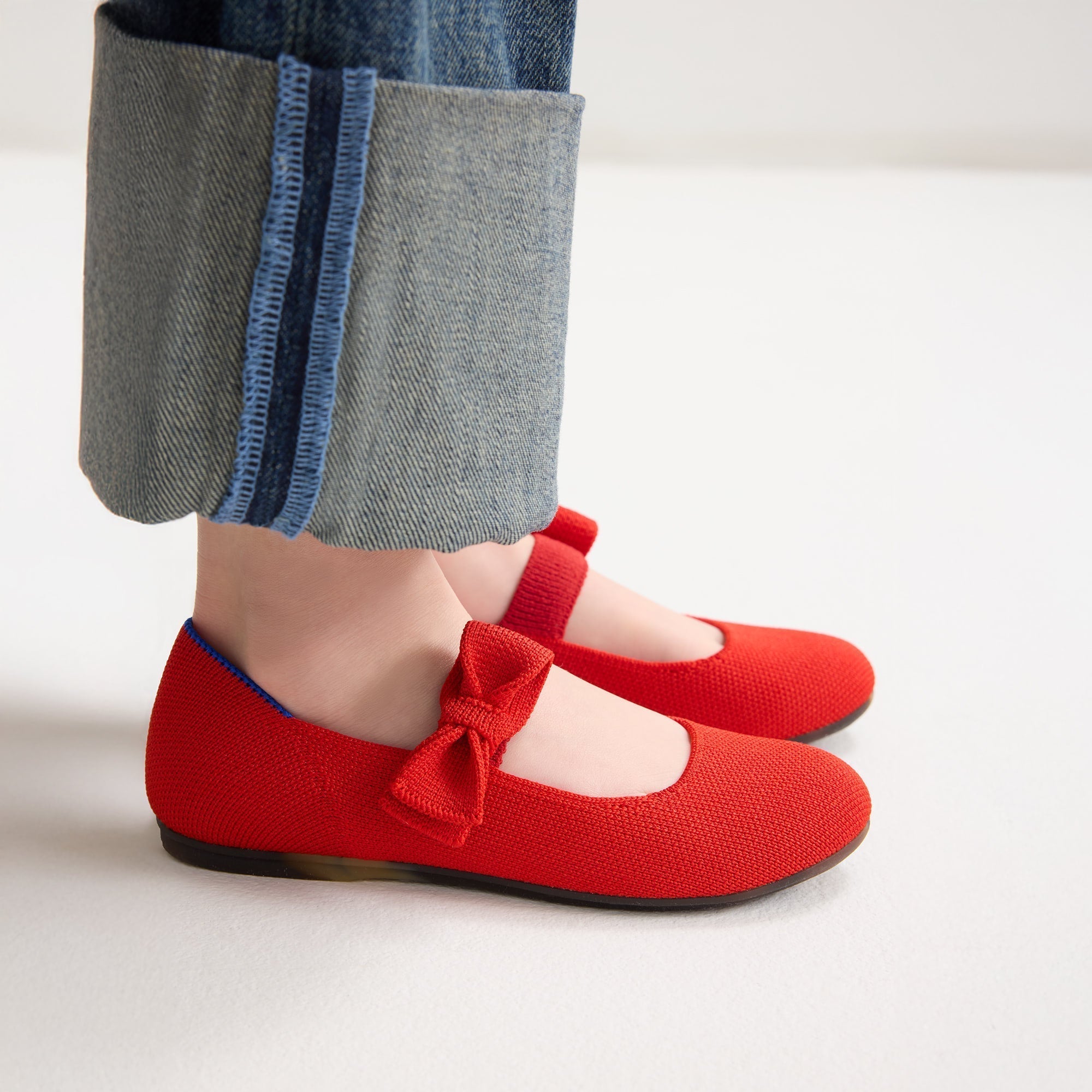 hover | Model wearing The Kids Tux Bow Mary Jane in Bright Red.