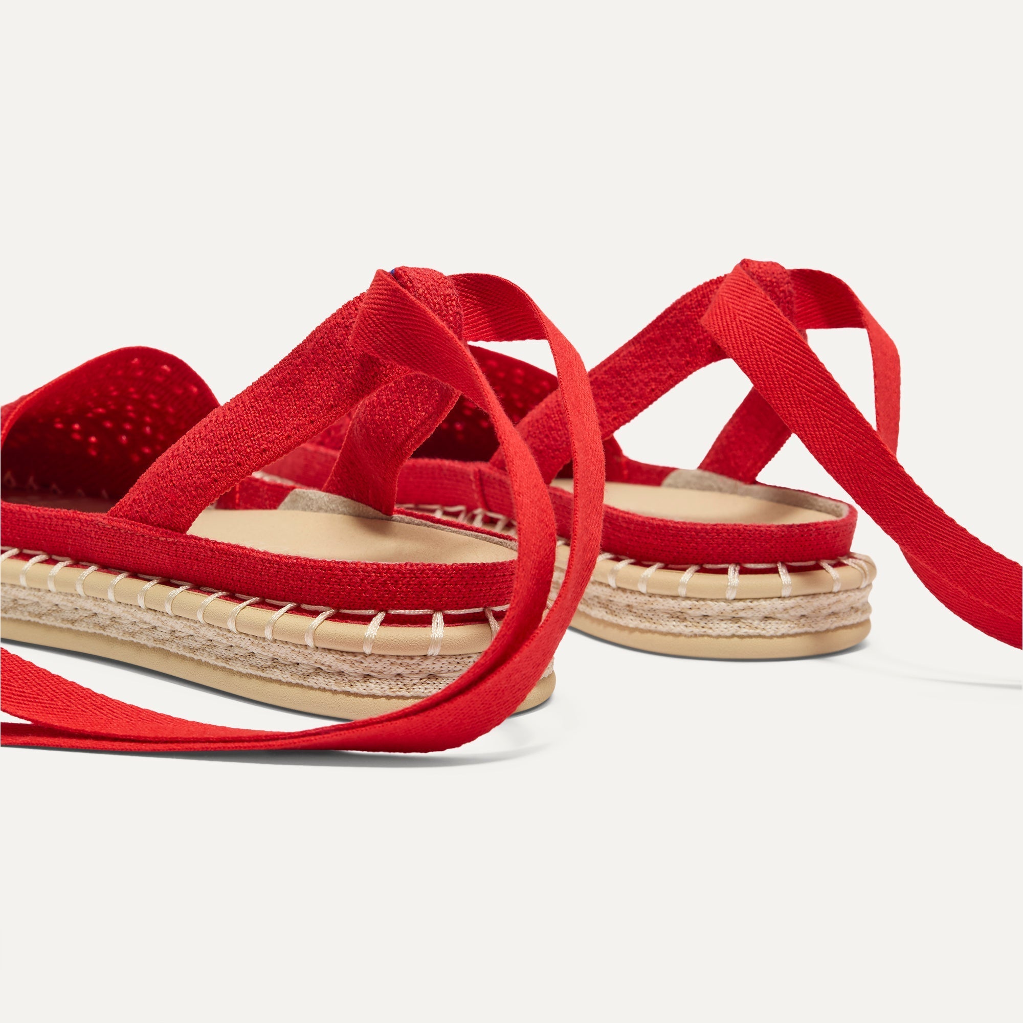 Close up of the heel of The D'Orsay Espadrille in Bright Red Crochet, showing removable ankle straps.