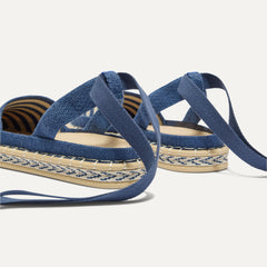 Close up of the heel of The D'Orsay Espadrille in Deep Sea Stripe, showing removable ankle straps.