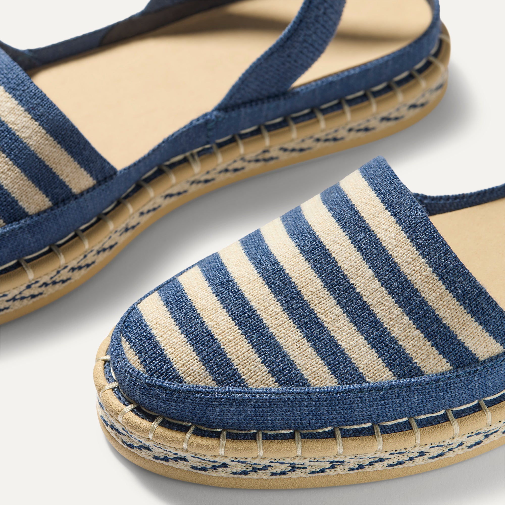 Close up of the vamp of The D'Orsay Espadrille in Deep Sea Stripe. 