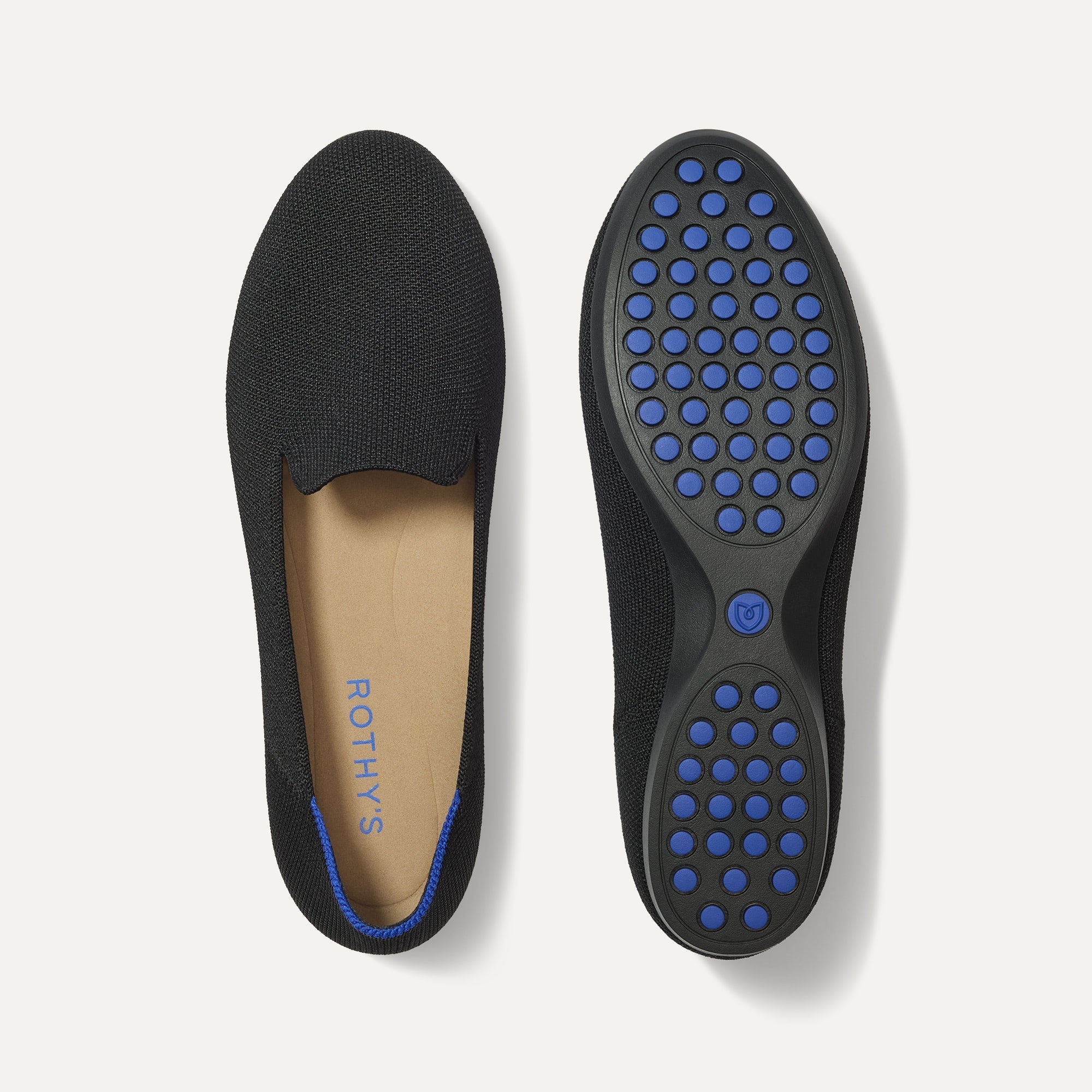 PLP |The Daily Loafer in Black shown from the top with one shoe showing the outsole. 