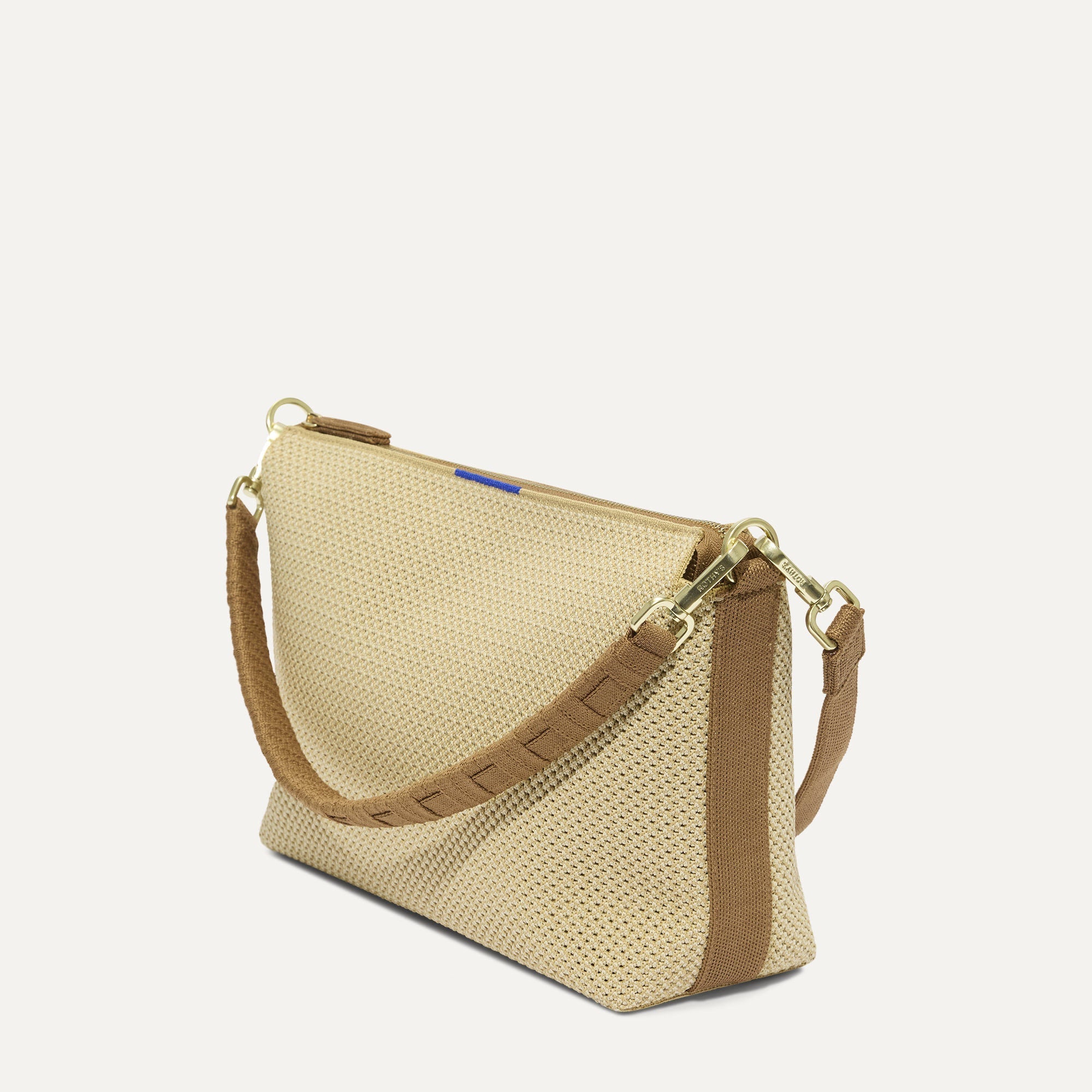 The Daily Crossbody in Macadamia Open-Knit shown at a diagonal view from the left.