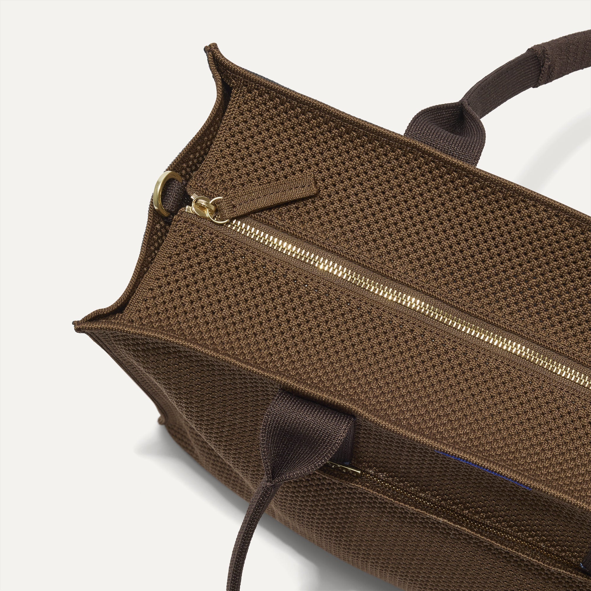 The Classic Tote in Cinnamon Open Knit, shown from above, with the top zipper closed. 