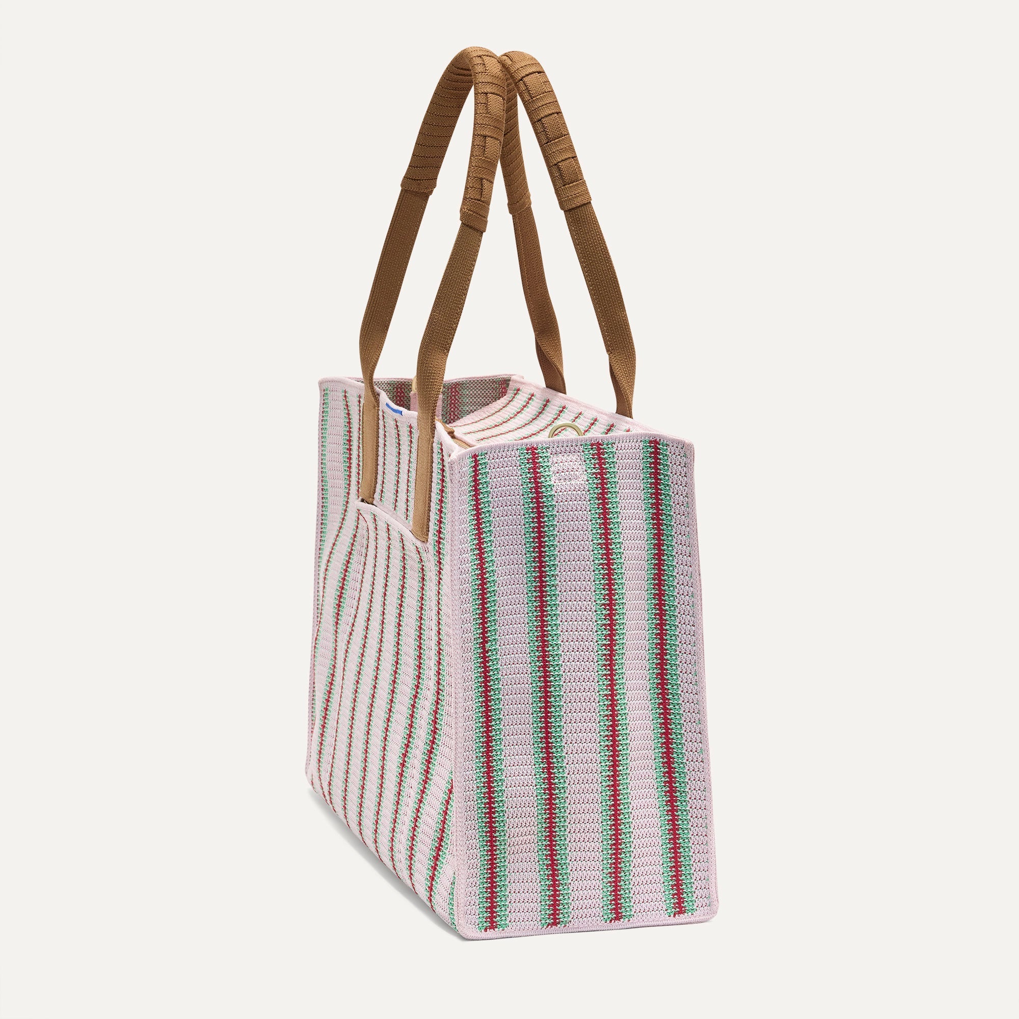 The Classic Tote in Watermelon Market Stripe, shown from the side.