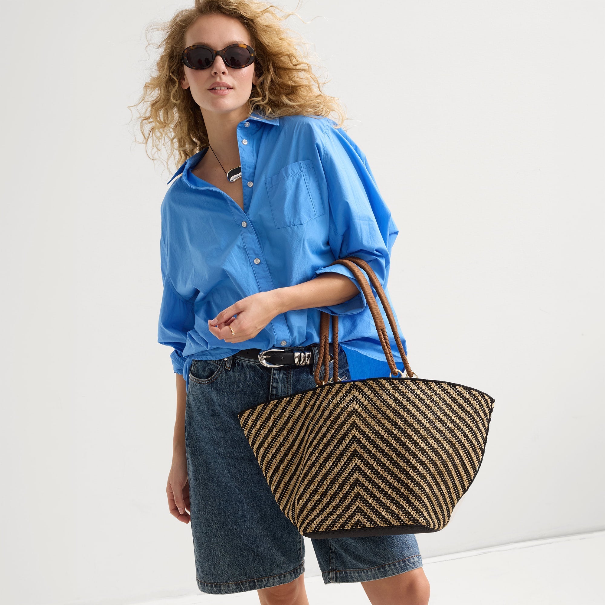 hover |Model shown holding The Summer Tote in Toffee Chevron shown from the front.