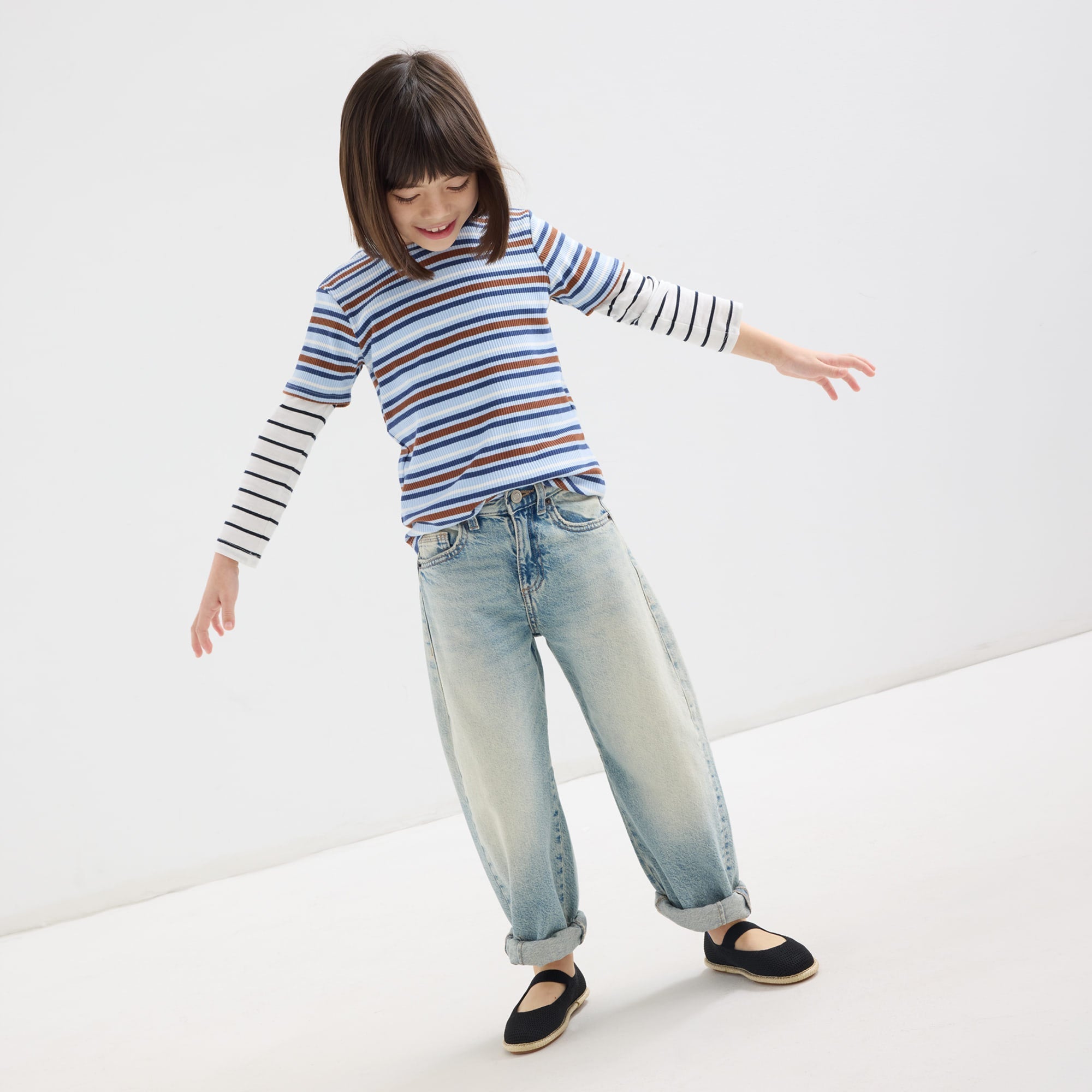 model | Alternate view of a model wearing The Mini Mary Jane in Black Raffia-Knit.