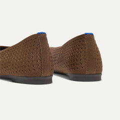 Close up of the heel of The Max Square Ballerina in Cinnamon Mesh with Rothy's signature blue halo.