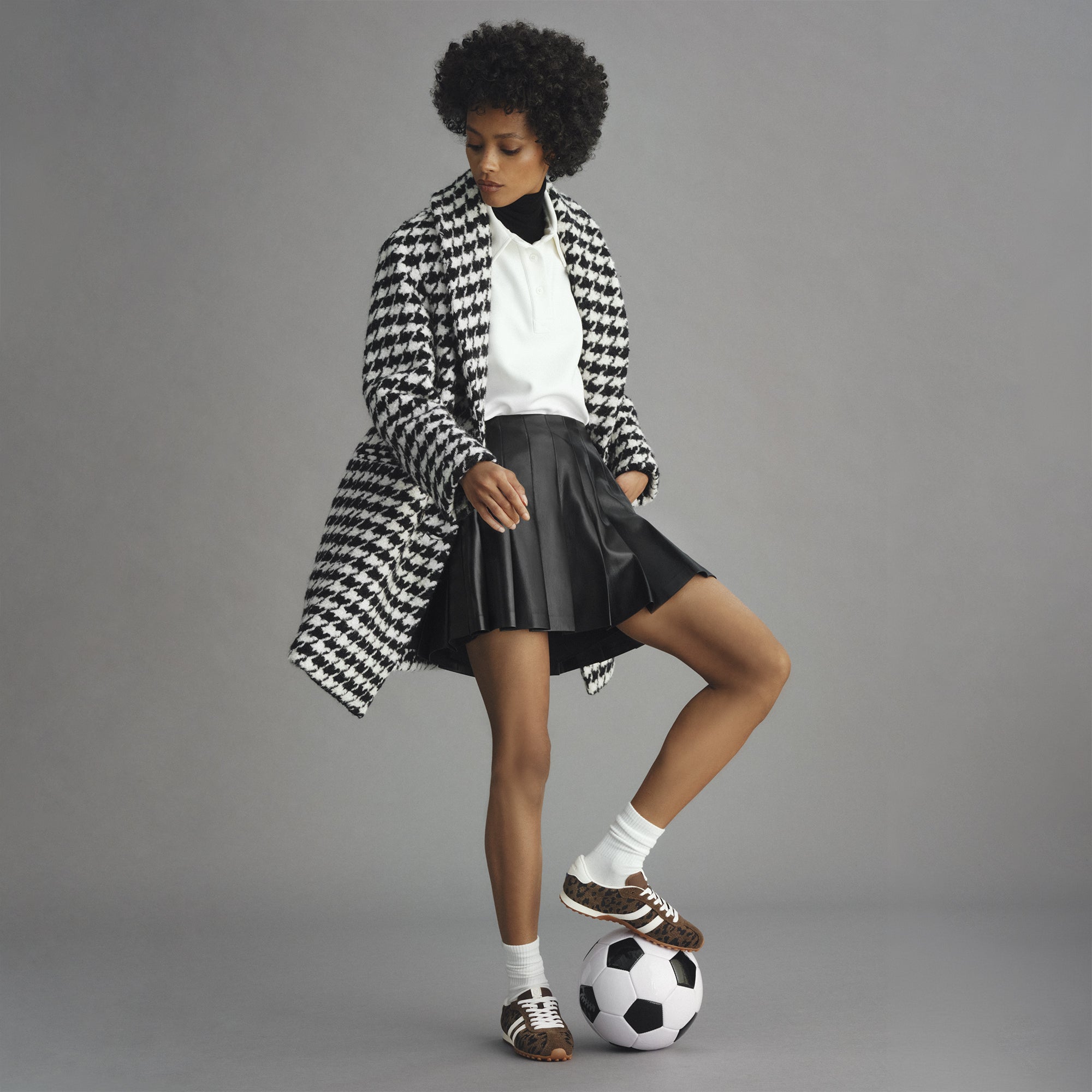 model | Alternate view of a model wearing The Ivy Sneaker in ReVelvet Cheetah. 
