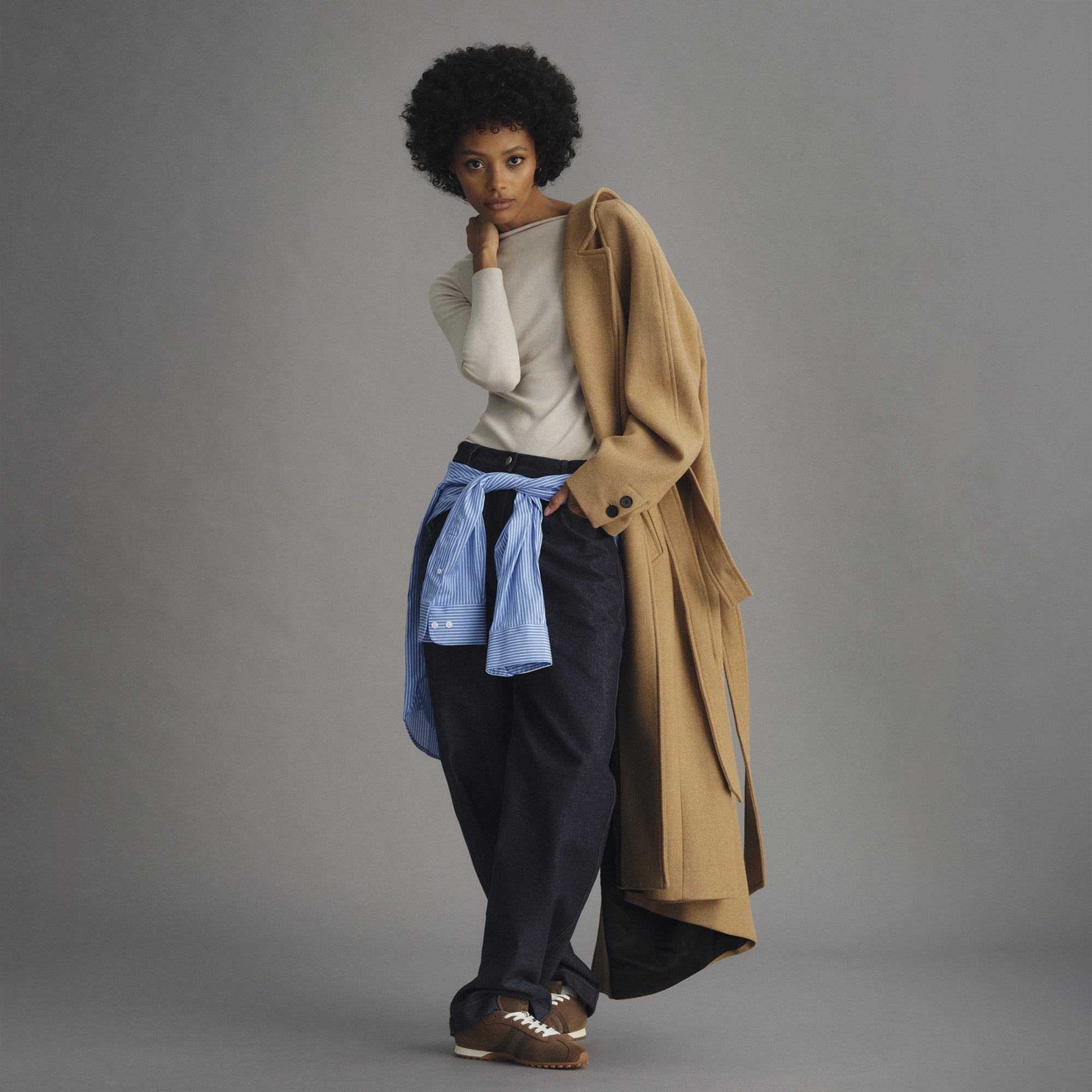 model | Alternate view of a model wearing The Ivy Sneaker in ReVelvet Cinnamon. 