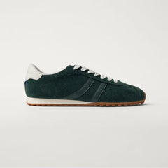 side | The Ivy Sneaker in ReVelvet Evergreen shown from the side.