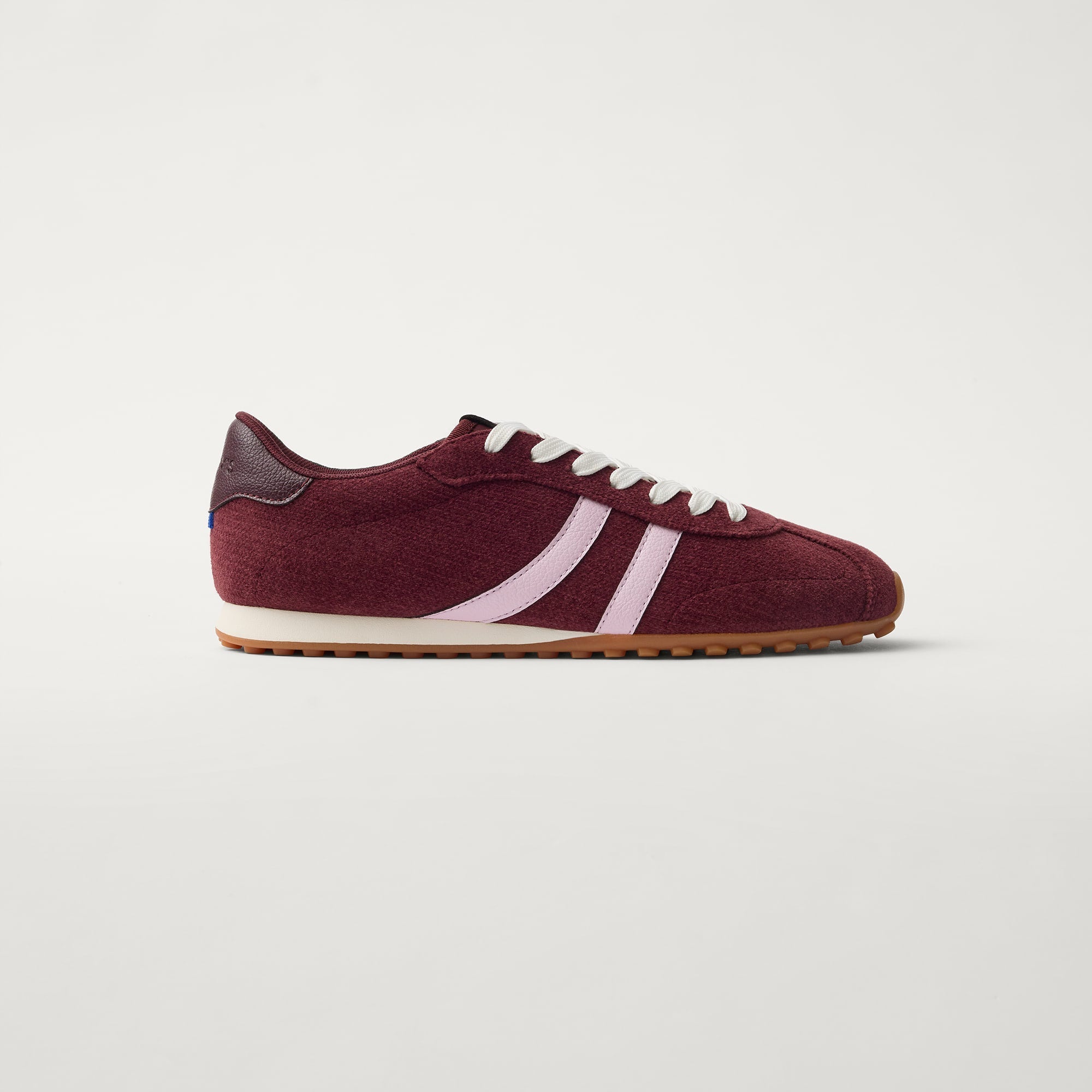 side | The Ivy Sneaker in ReVelvet Syrah shown from the side.