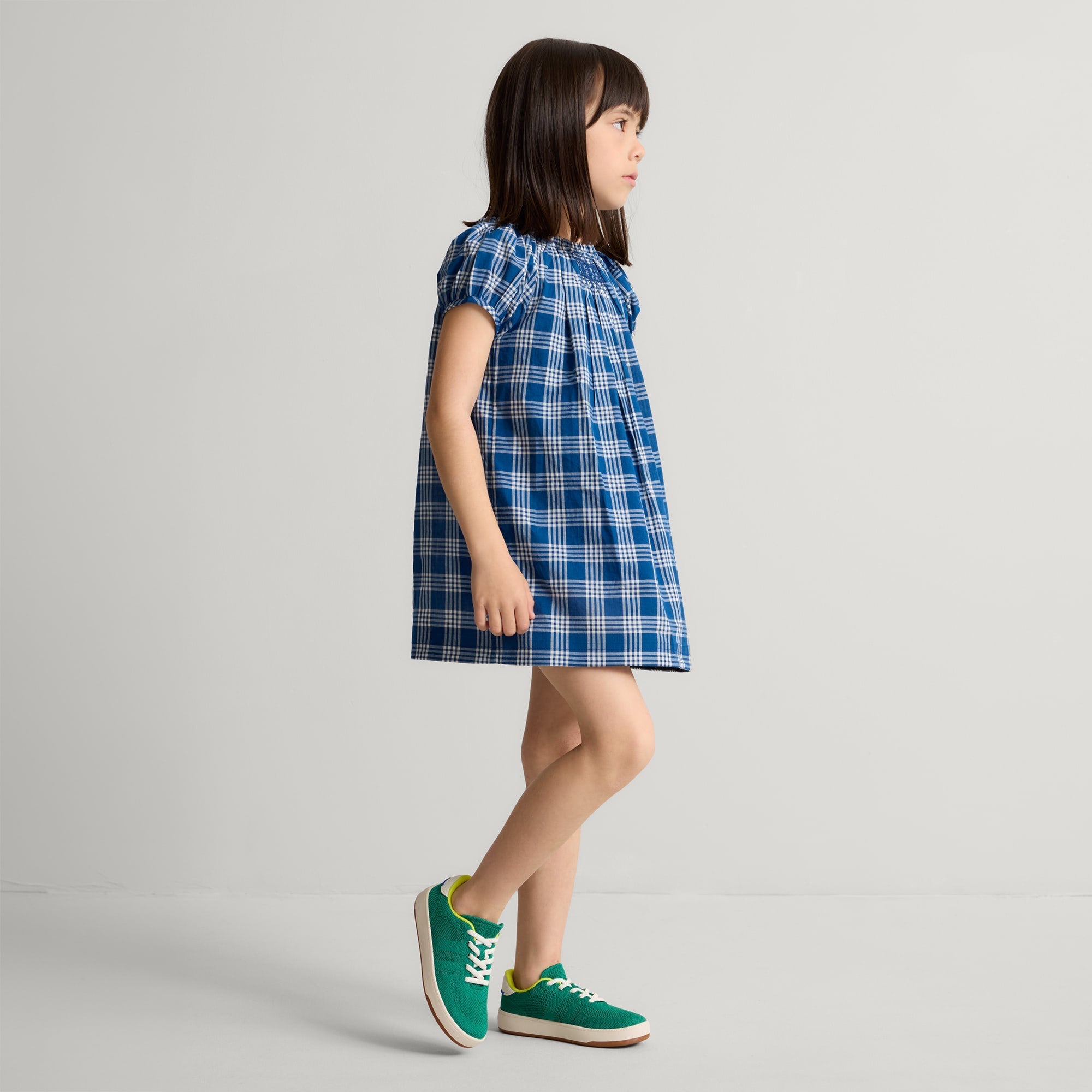 model | Alternate image of a child modeling The Kids Stretch Sneaker in Emerald Pop.